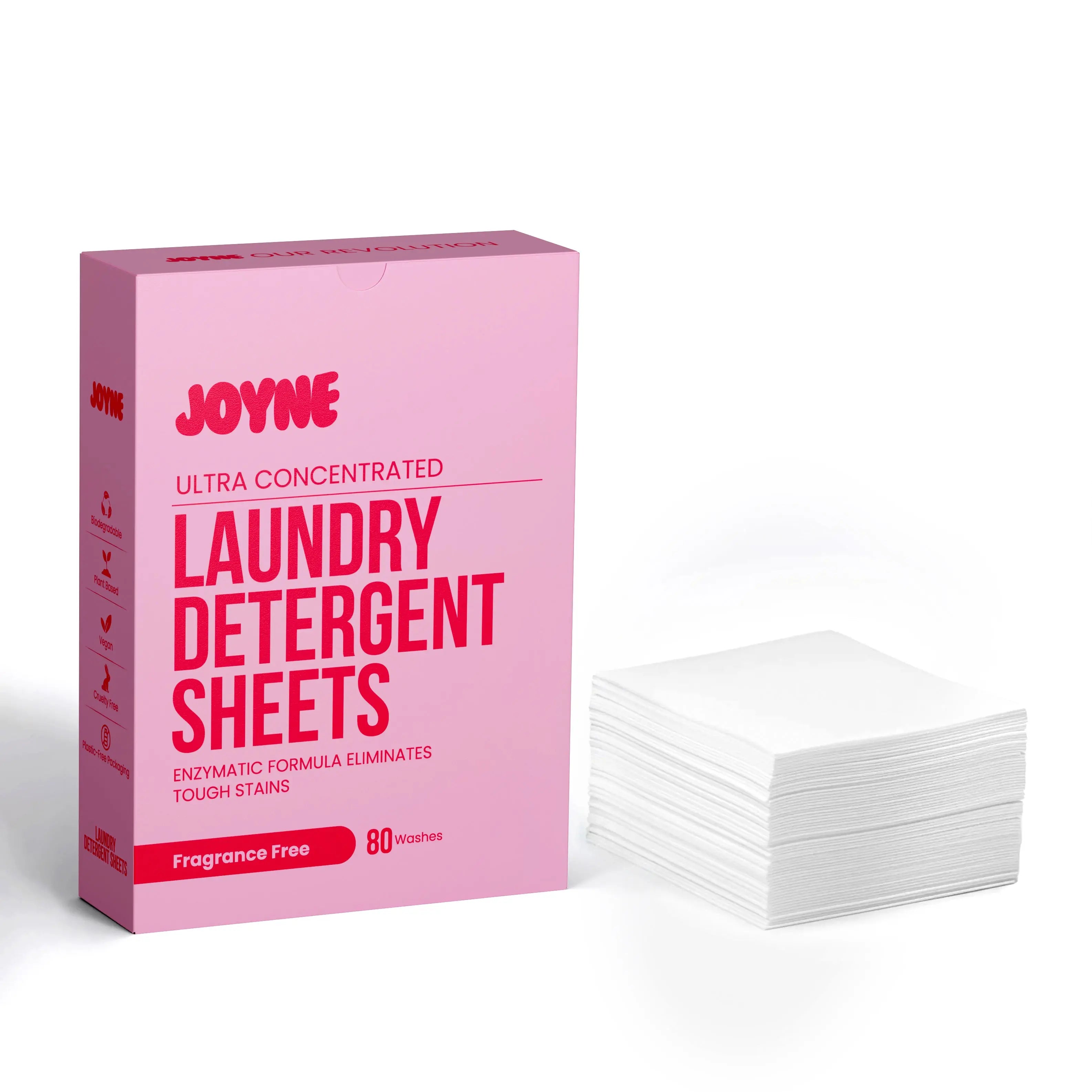 A Pink box of JOYNE laundry detergent sheets with a stack of white sheets next to it